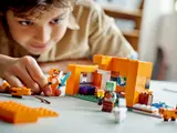 Child playing with Fox Lodge set.