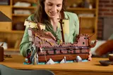 Woman interacting with closed Goonies ship.