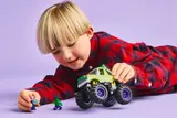 Child playing with the Hulk truck set.