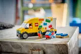 Open LEGO van display with minifigure employees.