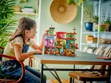 Girl playing with Madrigal House interior.