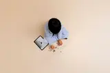 Child building with tablet.