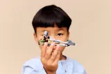 Child holding speeder bike.