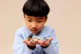 Child admiring speeder bike.