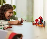 Child playing with LEGO Ghast.