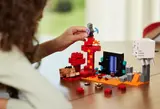 Child posing LEGO Piglin.