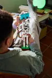 Holding Skeleton and teal block.