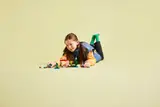Child playing with LEGO Minecraft set.