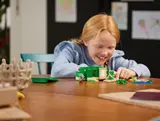 Child playing with set.
