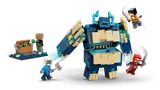 Warden opening its chest in attack, minifigures reacting around it.