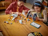 Kids rebuilding ships with tablet.