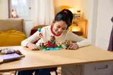 Builder admires LEGO Animal Crossing set.