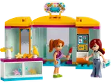 Open LEGO Friends accessory store with two minifigures.