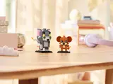 Tom and Jerry BrickHeadz in a room setting.
