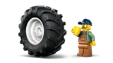 Minifigure and giant tractor tire.