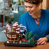 Woman interacting with Tranquil Garden set.