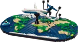 Airplane flying over LEGO world map.
