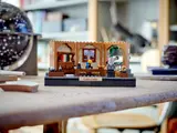 Galileo set on a wooden desk.