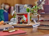 Lego Jane Austen set on a study desk.