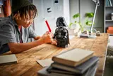 Admiring completed LEGO Darth Vader.