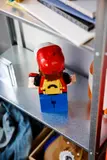 Back view, LEGO Red on shelf.