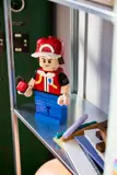 LEGO Red on display shelf.