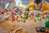Father and son building LEGO set.