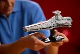 Man holds Venator Cruiser.