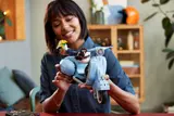 Woman holding LEGO Vespa 125.