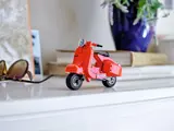 Vespa on a white shelf