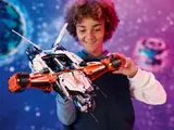Child holding VTOL spaceship.