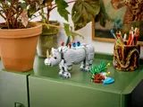 LEGO rhino display on a green cabinet.