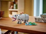 LEGO hippo model on a wooden table with small habitat.