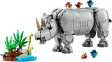 Grey LEGO rhino with two birds and a small plant/water build.
