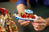 Holding Wonka's boat.