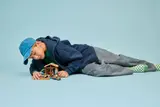 Child playing with the LEGO hut set.