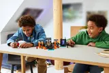 Kids playing with LEGO Minecraft Wither set.
