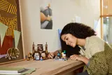 Girl playing with LEGO Minecraft 21272 set.