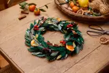 LEGO Holiday Wreath with red berries in a craft setting.