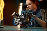 Woman interacting with Technic Yamaha MT-10 SP.