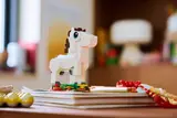Close-up of LEGO horse on books.