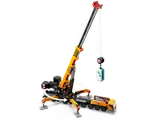 Crane with extended outriggers and boom.