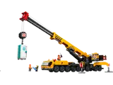 Yellow LEGO mobile crane lifting a portable toilet.