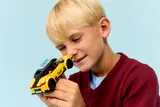 Child examining taxi