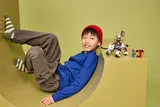 Child relaxing with Ninjago set.