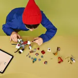 Child adding section to dragon model.