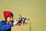 Child playing with completed dragon set.