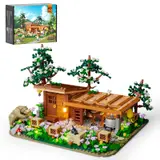 Lumibricks F9062 Bee Farm set with cabin, trees, beehives, and minifigs.