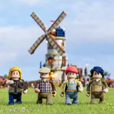 Minifigures in foreground, windmill blurred.