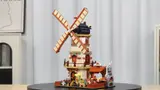 Rotating windmill model on display.